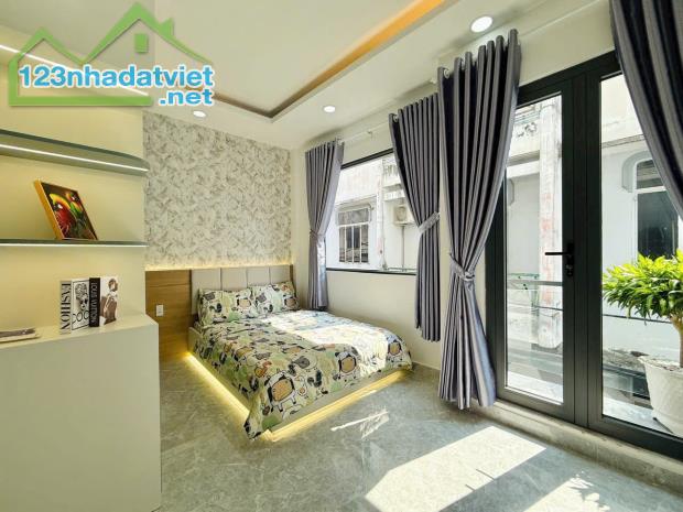 Bán nhà 2 mặt hẻm 5m thông đường Lê Đức Thọ, P.15, 5,5 x 11 NH 11m, 4 lầugiá 6.38 tỷ tl