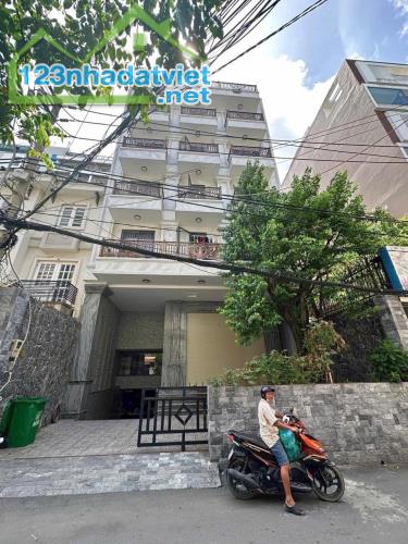 Bán Tòa CHDV Lạc Long Quân - 251m2 x 9T - Tầng hầm Thang máy - Ngõ thông oto đỗ cổng