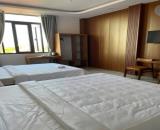 Bán KHÁCH SẠN ngay KDC Nam Long Hà Huy Giáp ngang 9m 7 lầu 180m2 26PN T.máy TN 70tr 25 tỷ