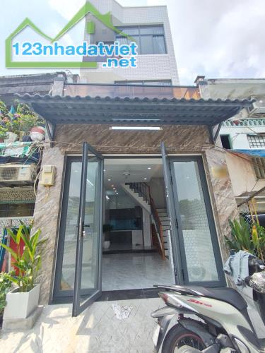 Nhà mới 4 tầng mặt tiền đường Ụ Cây P10 Q8. Giá: 5.39 tỷ